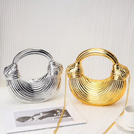 Bolso de mano tipo clutch de acrílico brillante con nudo, ideal para cenas, eventos informales, fiestas, graduaciones y eventos especiales.