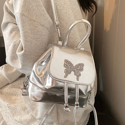 Mochila pequeña plateada, bolso de mujer versátil y moderno para viajes, mochila mini, bolso de estudiante, bolso pequeño tipo mochila para mujer