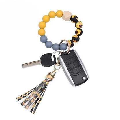 Llavero con borla de PU para bolso de mujer, llavero de silicona con cuentas, pulsera, llavero de coche, bonito soporte para mujeres y niñas. 