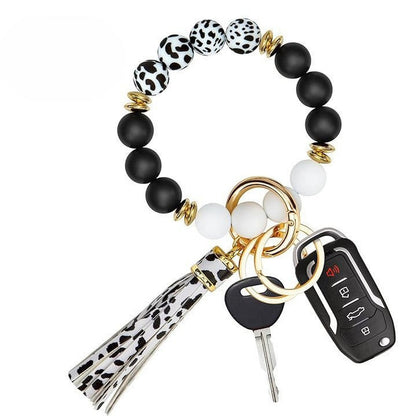 Llavero con borla de PU para bolso de mujer, llavero de silicona con cuentas, pulsera, llavero de coche, bonito soporte para mujeres y niñas. 