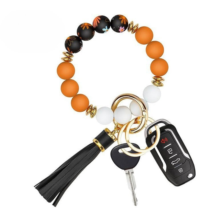 Llavero con borla de PU para bolso de mujer, llavero de silicona con cuentas, pulsera, llavero de coche, bonito soporte para mujeres y niñas. 