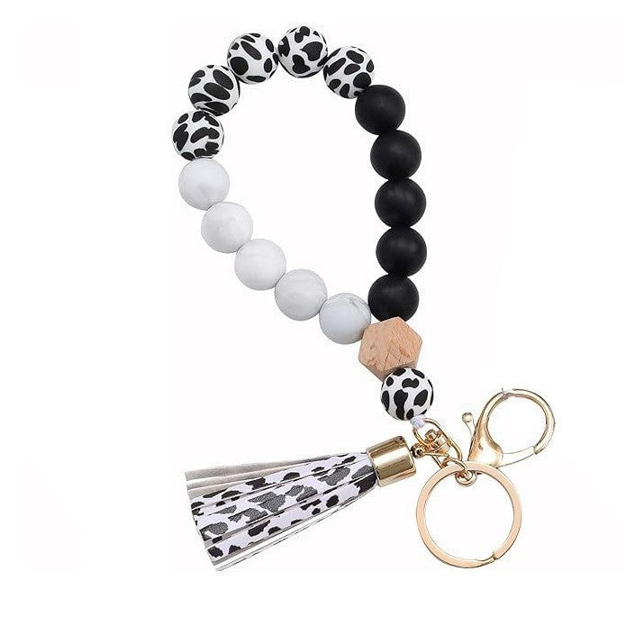 Llavero con borla de PU para bolso de mujer, llavero de silicona con cuentas, pulsera, llavero de coche, bonito soporte para mujeres y niñas. 