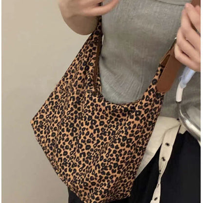 Bolso hobo de gran capacidad con estampado de leopardo, bolso tote para mujer, bolso de hombro versátil y a la moda, bolso de lona para el día a día. 