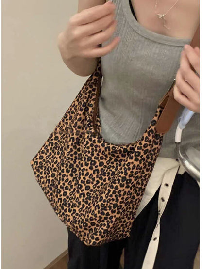 Bolso hobo de gran capacidad con estampado de leopardo, bolso tote para mujer, bolso de hombro versátil y a la moda, bolso de lona para el día a día. 