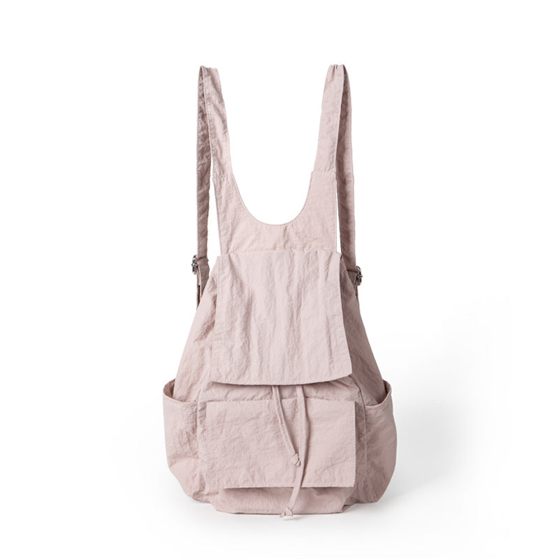 Mochila ligera de nailon para mujer, con múltiples bolsillos y diseño plisado, color beige. 