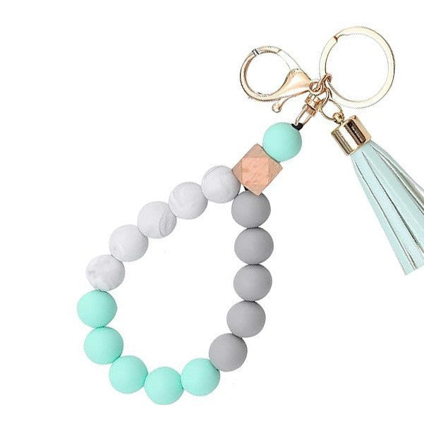 Llavero con borla de PU para bolso de mujer, llavero de silicona con cuentas, pulsera, llavero de coche, bonito soporte para mujeres y niñas. 