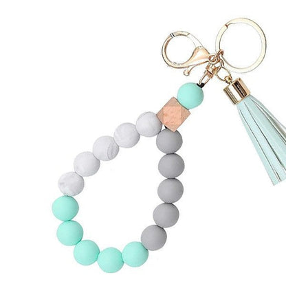 Llavero con borla de PU para bolso de mujer, llavero de silicona con cuentas, pulsera, llavero de coche, bonito soporte para mujeres y niñas. 