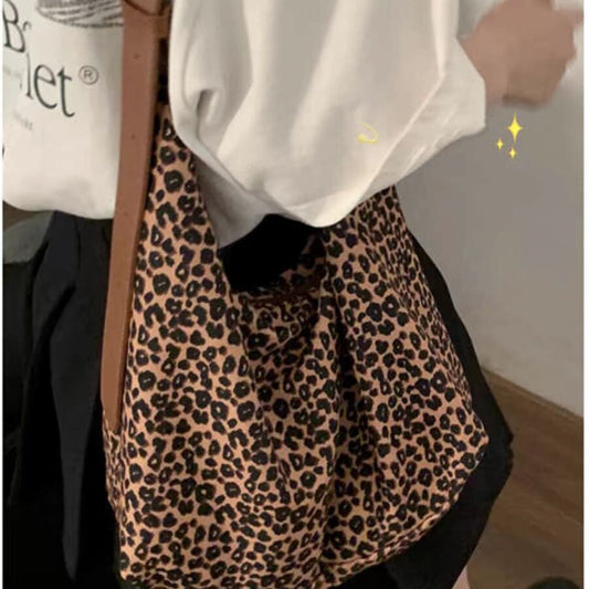 Bolso hobo de gran capacidad con estampado de leopardo, bolso tote para mujer, bolso de hombro versátil y a la moda, bolso de lona para el día a día. 