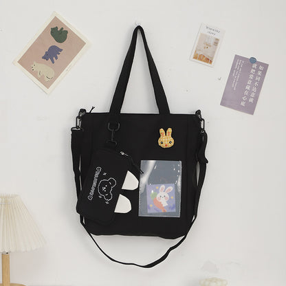 Bolso de lona con diseño de dibujos animados, bolso tote con colgante de conejito, bolso pequeño independiente para estudiantes 