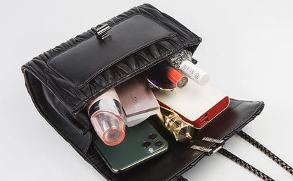 Bolso bandolera con cadena y camelia bordada