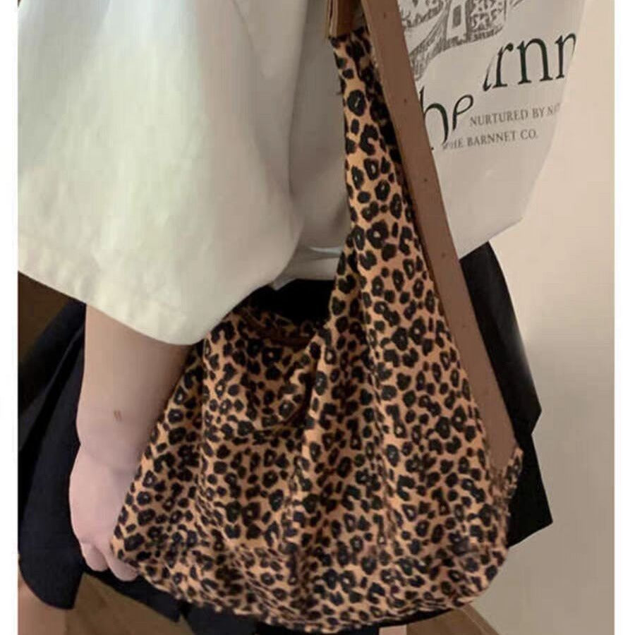 Bolso hobo de gran capacidad con estampado de leopardo, bolso tote para mujer, bolso de hombro versátil y a la moda, bolso de lona para el día a día. 