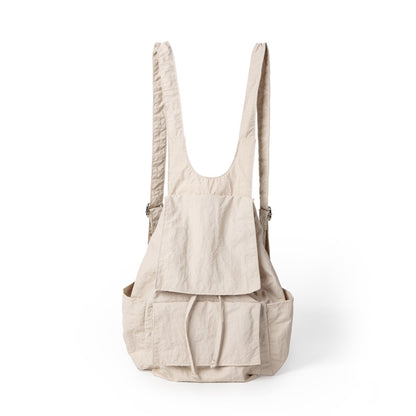 Mochila ligera de nailon para mujer, con múltiples bolsillos y diseño plisado, color beige. 