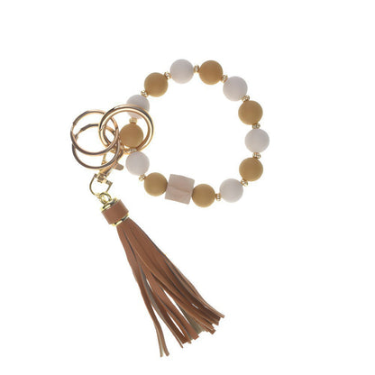 Llavero con borla de PU para bolso de mujer, llavero de silicona con cuentas, pulsera, llavero de coche, bonito soporte para mujeres y niñas. 