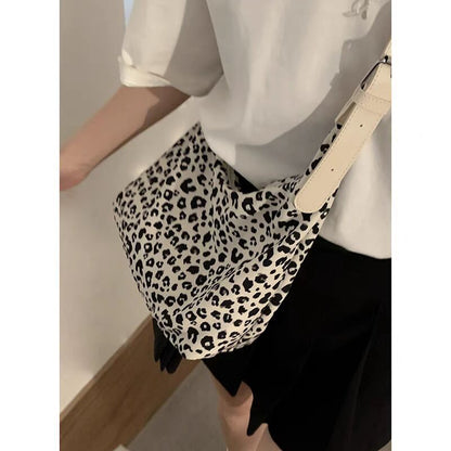 Bolso hobo de gran capacidad con estampado de leopardo, bolso tote para mujer, bolso de hombro versátil y a la moda, bolso de lona para el día a día. 