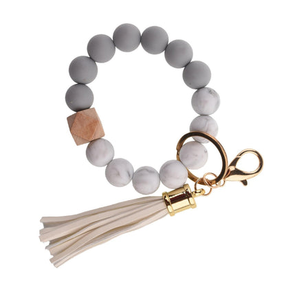 Llavero con borla de PU y cuentas de silicona para bolso, pulsera, llavero de coche, para mujeres y niñas 
