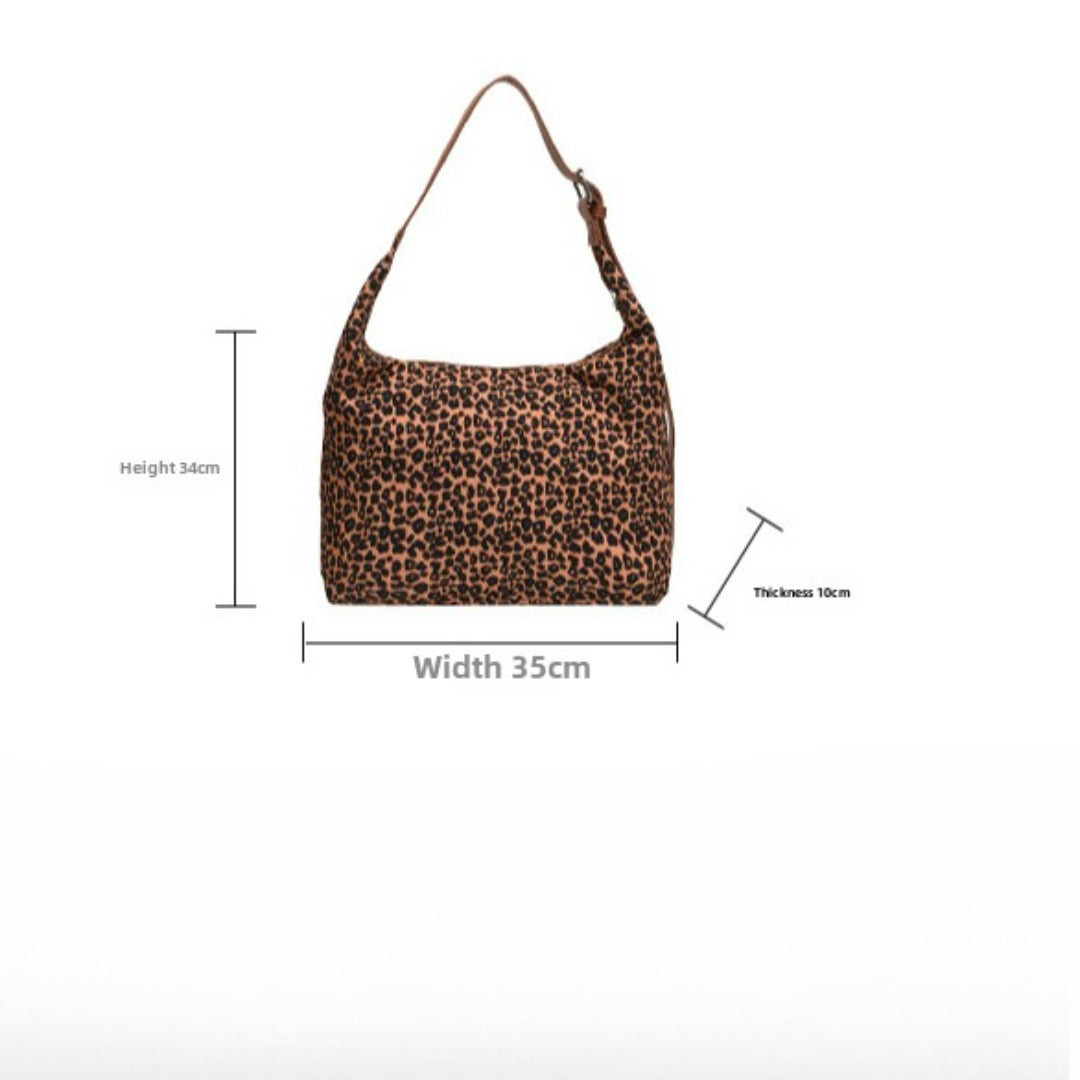 Bolso hobo de gran capacidad con estampado de leopardo, bolso tote para mujer, bolso de hombro versátil y a la moda, bolso de lona para el día a día. 
