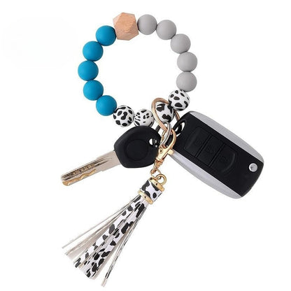 Llavero con borla de PU para bolso de mujer, llavero de silicona con cuentas, pulsera, llavero de coche, bonito soporte para mujeres y niñas. 