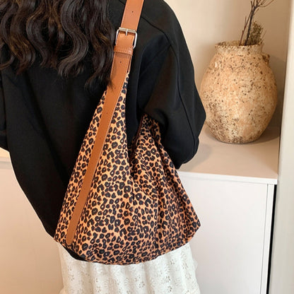 Bolso hobo de gran capacidad con estampado de leopardo, bolso tote para mujer, bolso de hombro versátil y a la moda, bolso de lona para el día a día. 