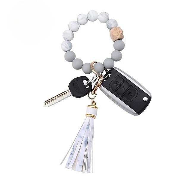 Llavero con borla de PU y cuentas de silicona para bolso, pulsera, llavero de coche, para mujeres y niñas 
