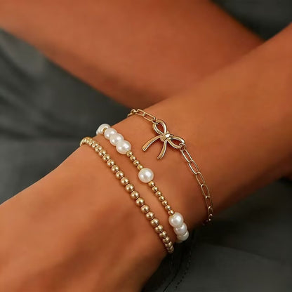 Minimalist Bow Pendant Bracelet with Pearl Accents