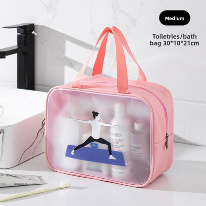 Pink toiletries bag with clear front on a bathroom counter