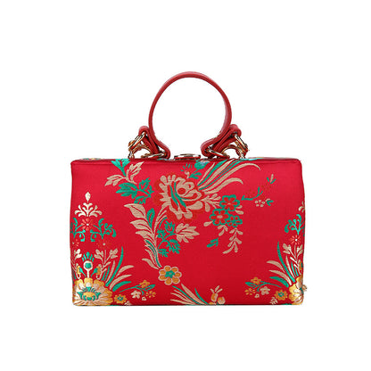 Bolso de mano tipo clutch con estampado floral, ideal para bodas y eventos especiales. Elegante diseño en tonos antiguos. 